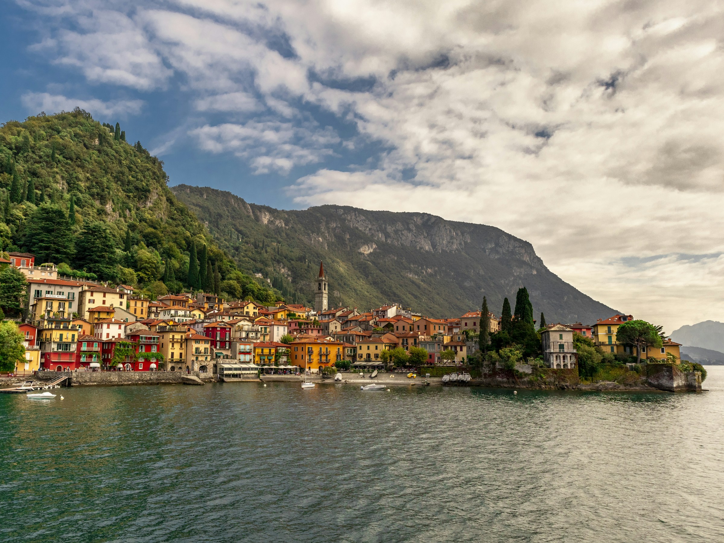 Colorful lakeside homes beneath the mountains of Lake Como, Italy